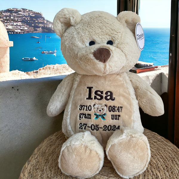 Teddy beer geboorteknuffel met gepersonaliseerde borduurde naam, geboortedatum en geboortegewicht.