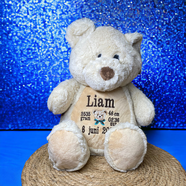 Teddy beer geboorteknuffel met gepersonaliseerde borduurde naam, geboortedatum en geboortegewicht.