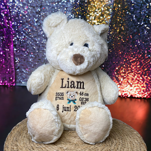 Teddy beer geboorteknuffel met gepersonaliseerde borduurde naam, geboortedatum en geboortegewicht.